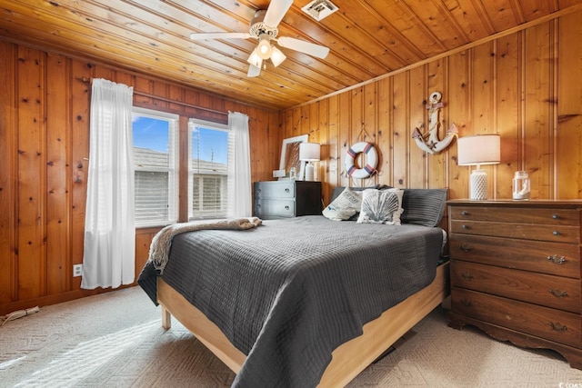 310 46th Ave N, North Myrtle Beach, SC 29582 - bedroom with wooden ceiling, carpet floors, wooden walls, and ceiling fan