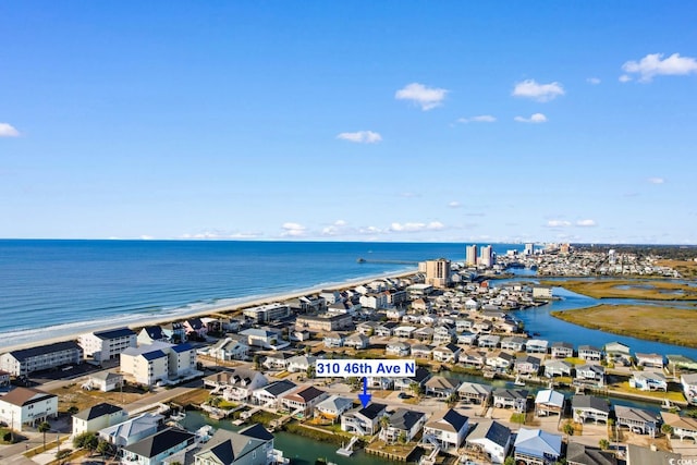 aerial view featuring a view of the beach and a water view