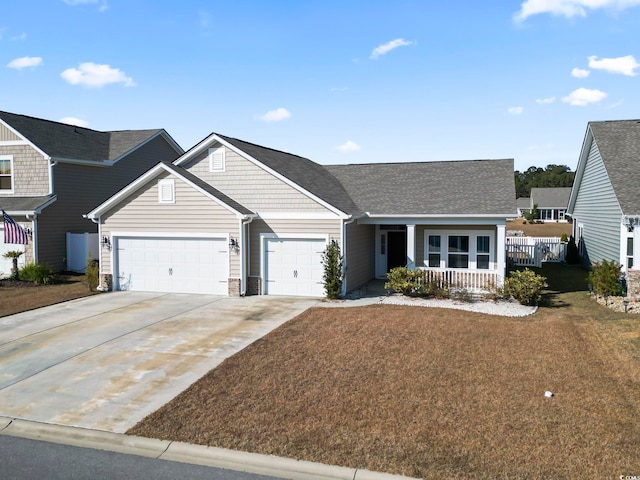 ranch-style house with covered porch and a garage