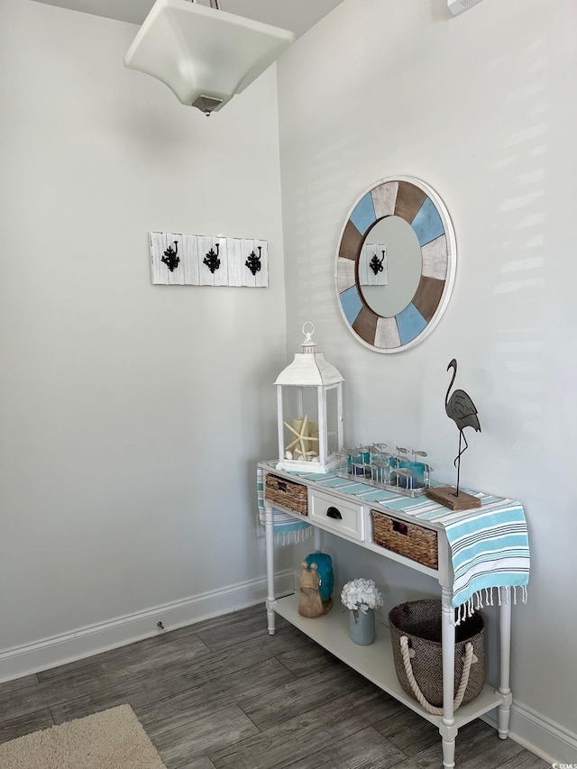 room details featuring visible vents, baseboards, and wood finished floors