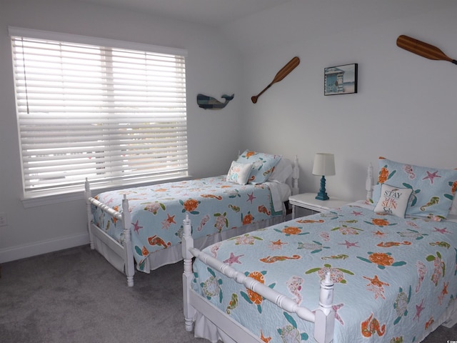 carpeted bedroom with baseboards