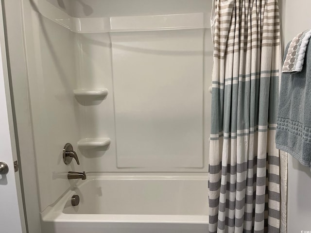 full bathroom featuring shower / bath combo with shower curtain