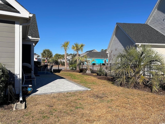 view of yard featuring a patio area and a fenced backyard