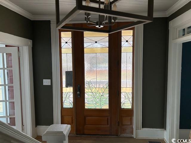 2708 Main St, Loris, SC 29569 - foyer with a chandelier and ornamental molding