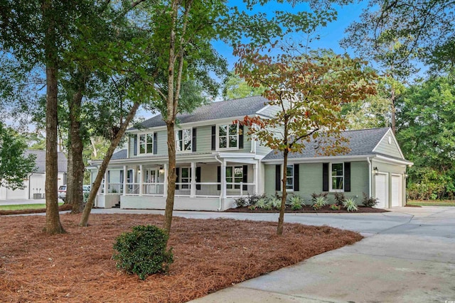 view of front of house with a garage and covered porch