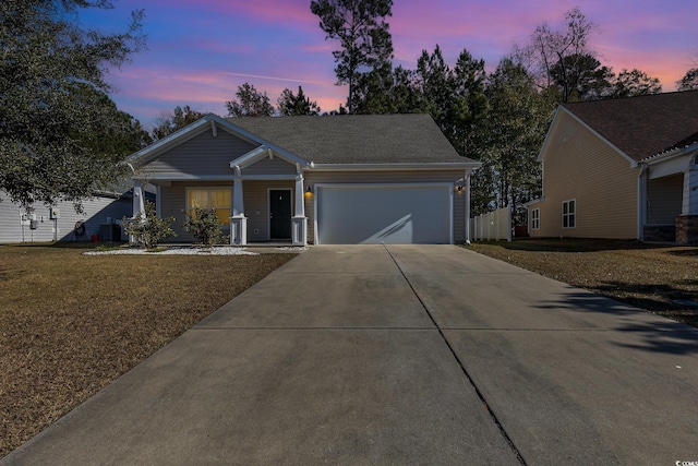 view of front facade featuring a garage and a front yard