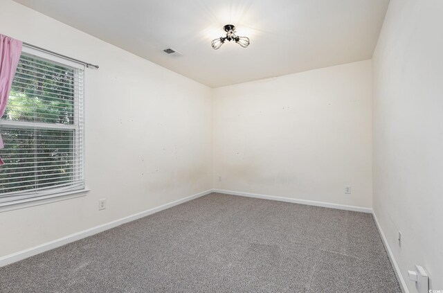 unfurnished room with carpet flooring