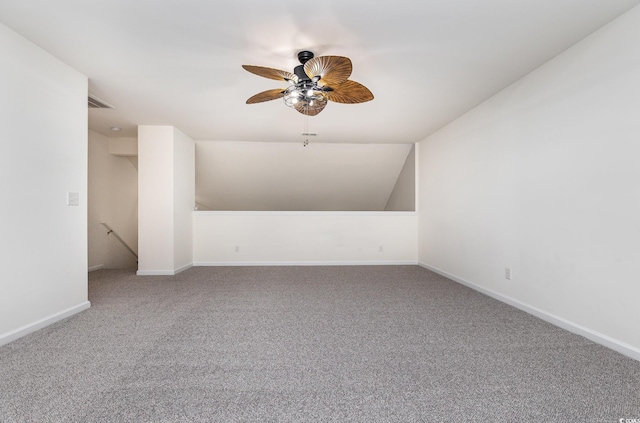 carpeted empty room with ceiling fan and lofted ceiling