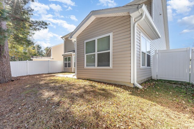 view of home's exterior with a yard