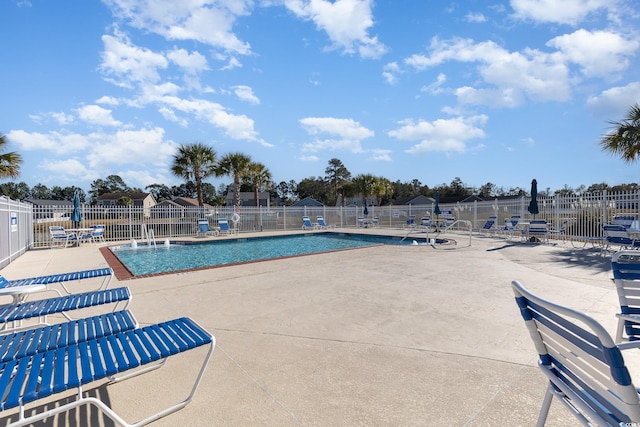 view of swimming pool featuring a patio