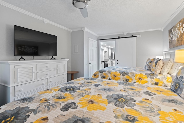 bedroom featuring a textured ceiling, a barn door, ceiling fan, and crown molding