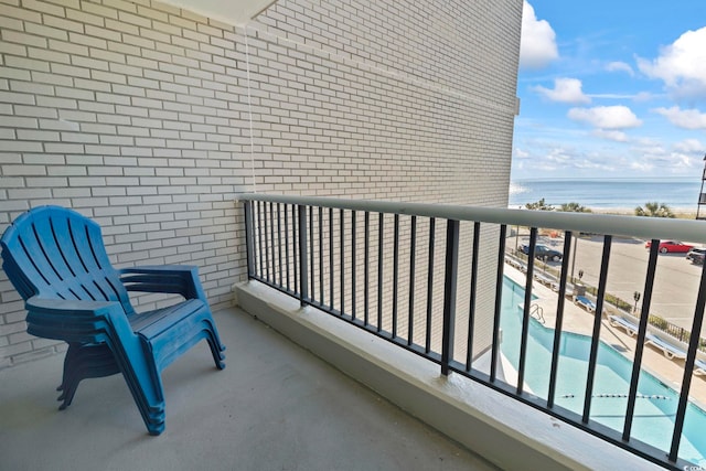 balcony featuring a water view