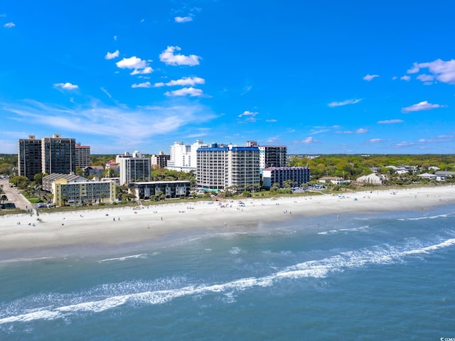 drone / aerial view with a beach view and a water view