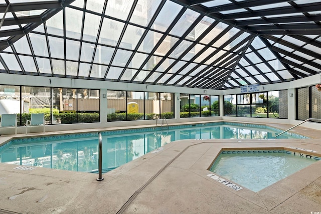 view of pool with an indoor hot tub