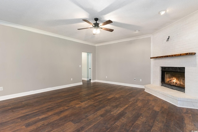 unfurnished living room featuring a textured ceiling, dark hardwood / wood-style floors, and a brick fireplace