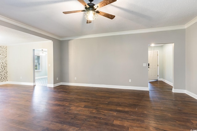 spare room with ceiling fan, crown molding, dark wood-type flooring, and a textured ceiling