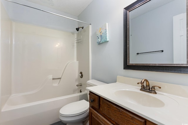 full bathroom with vanity, tub / shower combination, toilet, and a textured ceiling