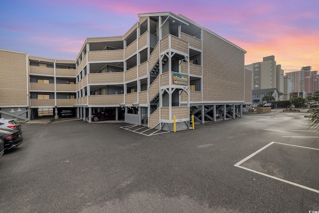 view of outdoor building at dusk