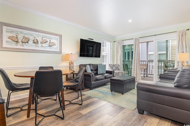 living room with ornamental molding and wood-type flooring