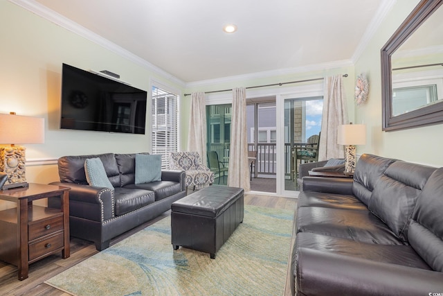 living room with hardwood / wood-style flooring and crown molding