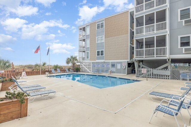 view of swimming pool with a patio