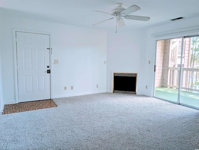 100G Myrtle Greens Dr Unit G, Conway, SC 29526 - unfurnished living room featuring carpet, a fireplace, ceiling fan, and heating unit