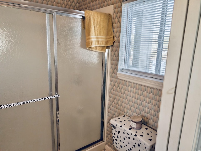 bathroom featuring an enclosed shower and tile walls