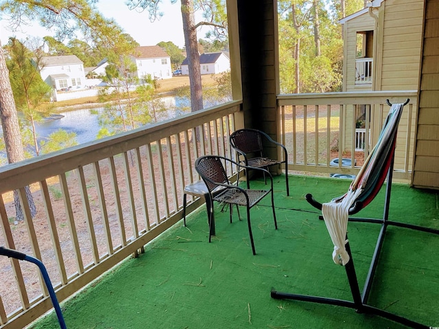 balcony featuring a water view