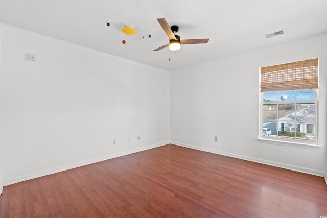 spare room with ceiling fan and wood-type flooring