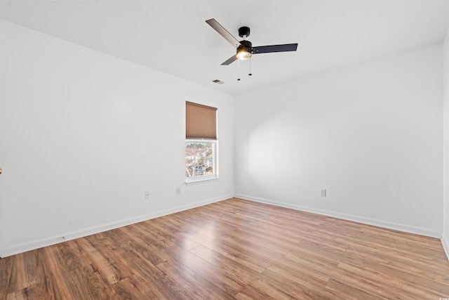 unfurnished room with light wood-type flooring and ceiling fan