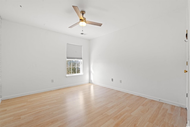 spare room with light hardwood / wood-style floors and ceiling fan