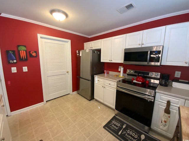 kitchen with white cabinets, ornamental molding, and appliances with stainless steel finishes