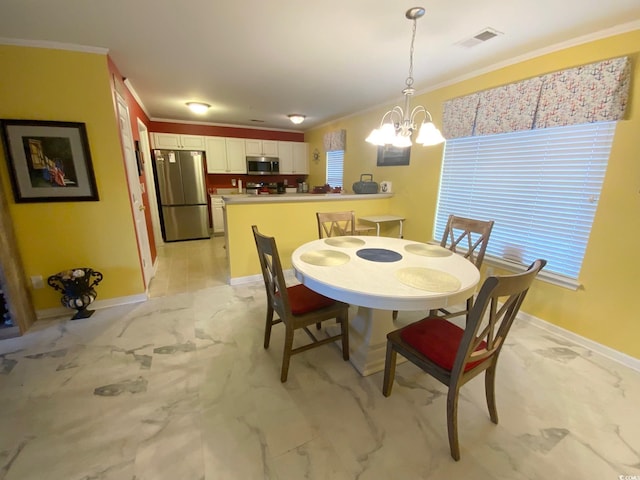 dining space with a notable chandelier and ornamental molding