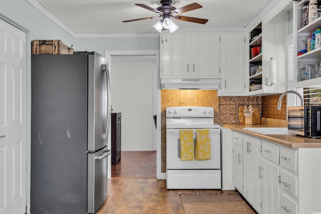 kitchen with under cabinet range hood, white electric range, white cabinetry, freestanding refrigerator, and open shelves