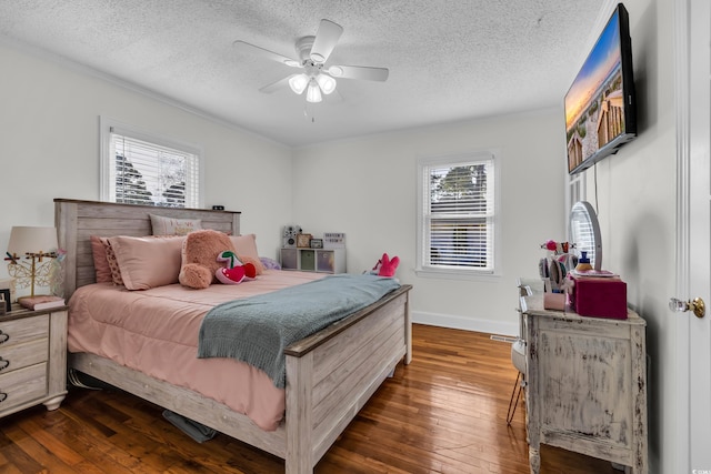 bedroom featuring dark wood-style floors, a textured ceiling, baseboards, and a ceiling fan