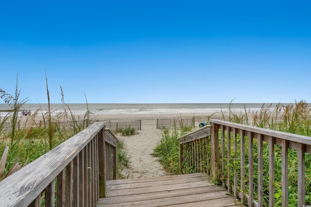 view of community featuring a view of the beach and a water view