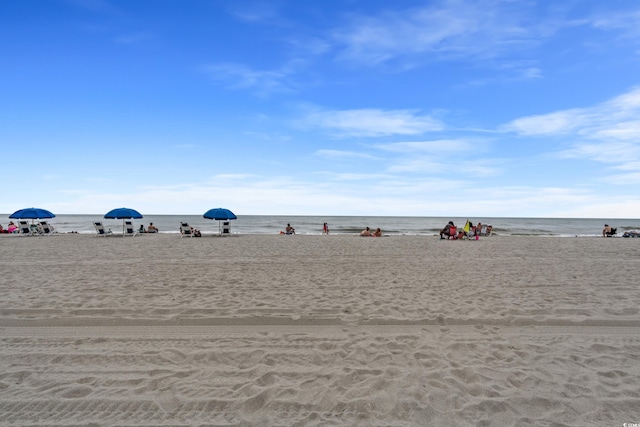 property view of water featuring a beach view