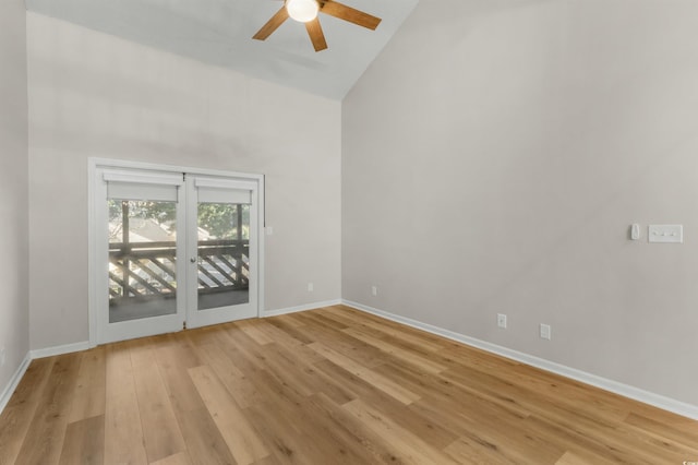 unfurnished room featuring ceiling fan, light hardwood / wood-style floors, and high vaulted ceiling