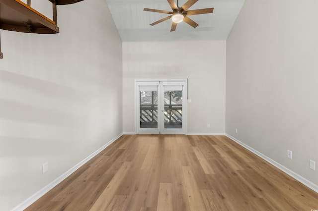 spare room with ceiling fan and light wood-type flooring