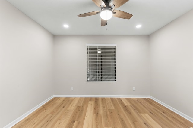 unfurnished room featuring ceiling fan and light hardwood / wood-style floors