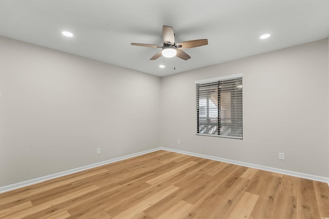 unfurnished room featuring light hardwood / wood-style flooring and ceiling fan