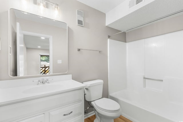 full bathroom featuring vanity, toilet, and tub / shower combination