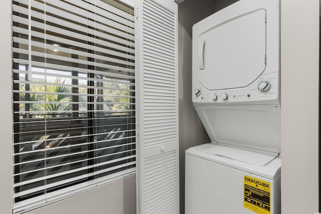 washroom featuring stacked washer and dryer