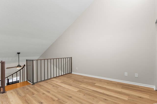 bonus room featuring light wood-type flooring, ceiling fan, and lofted ceiling