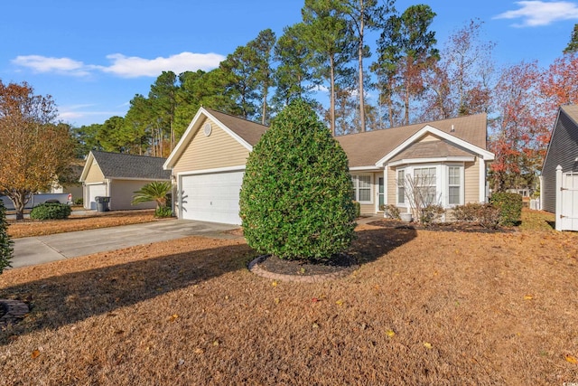 352 Mckendree Ln, Myrtle Beach, SC 29579 - view of front of house featuring concrete driveway, an attached garage, and a front lawn