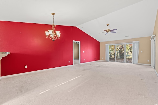 interior space with ceiling fan with notable chandelier, carpet floors, and vaulted ceiling