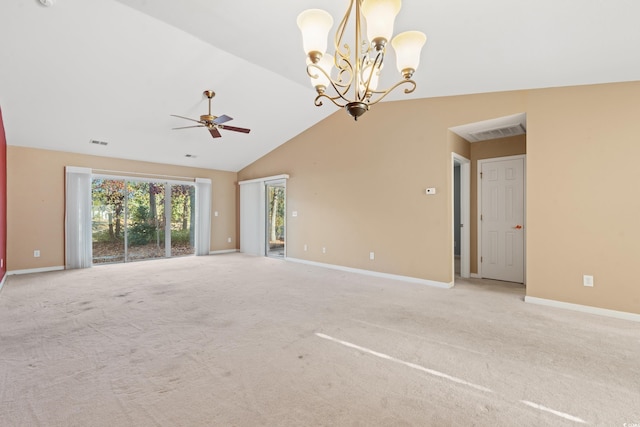 carpeted spare room with ceiling fan with notable chandelier and high vaulted ceiling