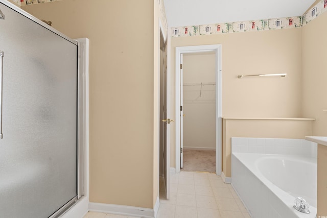 352 Mckendree Ln, Myrtle Beach, SC 29579 - full bath featuring a shower stall, a garden tub, a spacious closet, and tile patterned floors