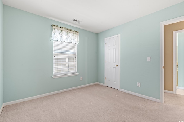 empty room with light colored carpet