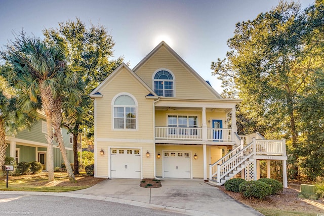 view of front of home with covered porch and a garage